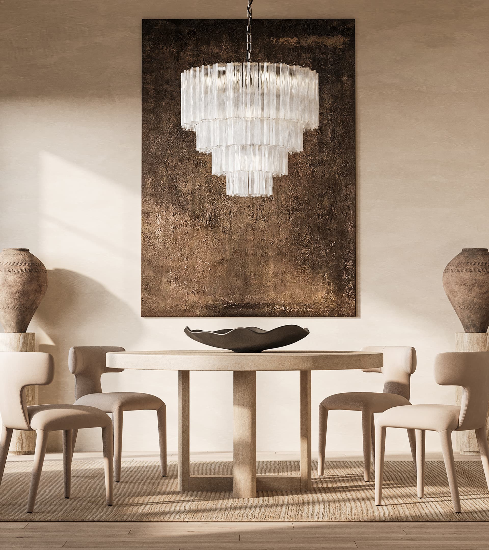 Round timber dining table with upholstered chairs beneath a tiered glass chandelier
