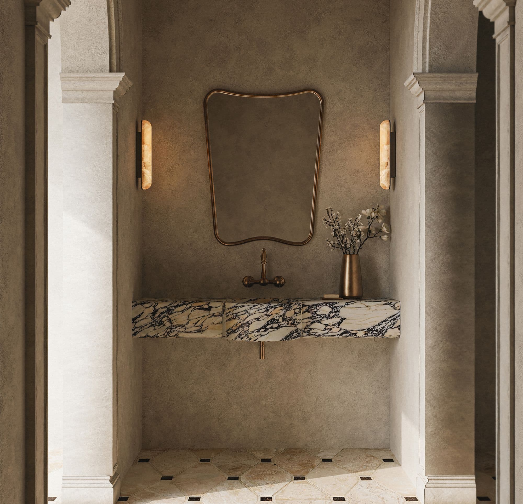 Marble vanity with alabaster wall sconces and a curved brass mirror