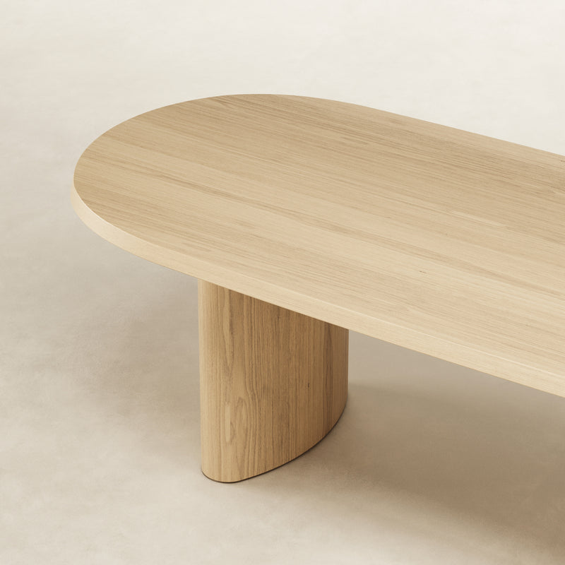 Ash wood dining table with curved base